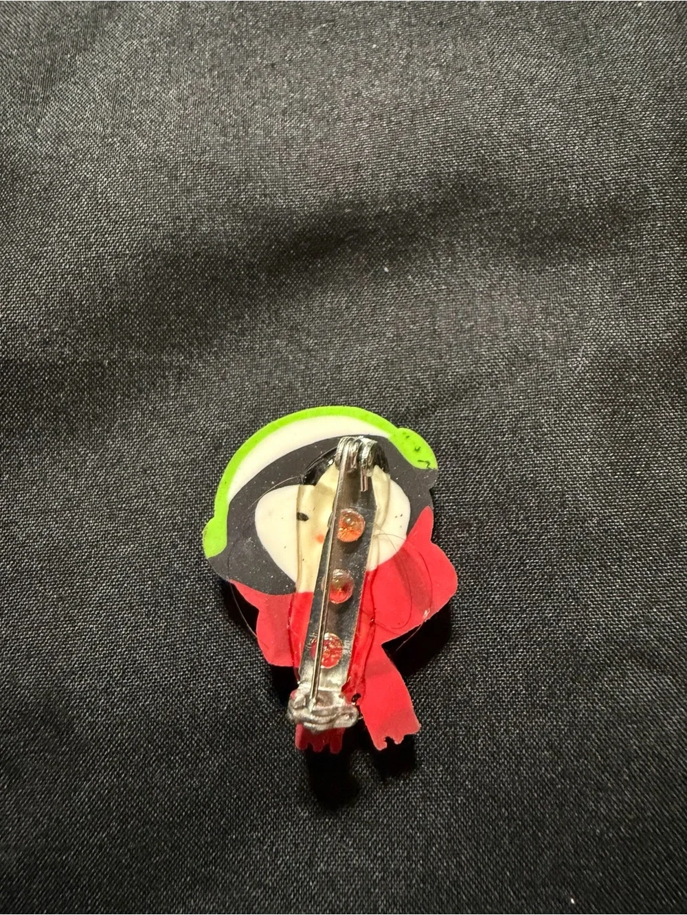 Source Unknown Penguin Eraser Pin with Green Headphones and Red Scarf